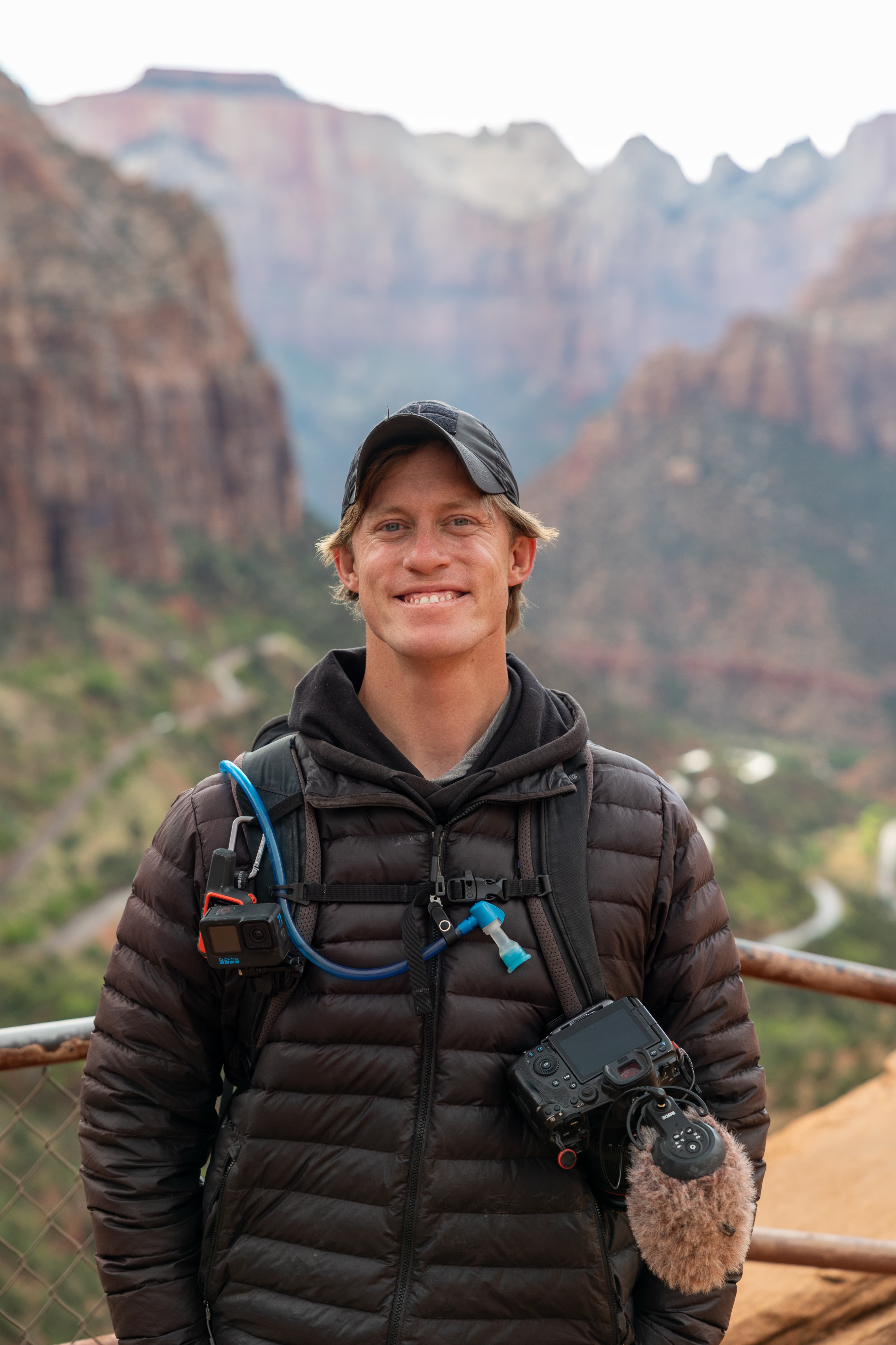 Elliot Schoenfeld standing in a sunlit studio.